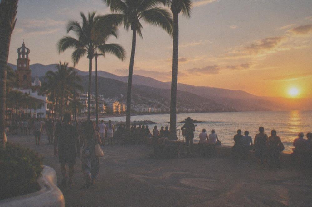 Golden evening light over the Puerto Vallarta waterfront and hills across the bay