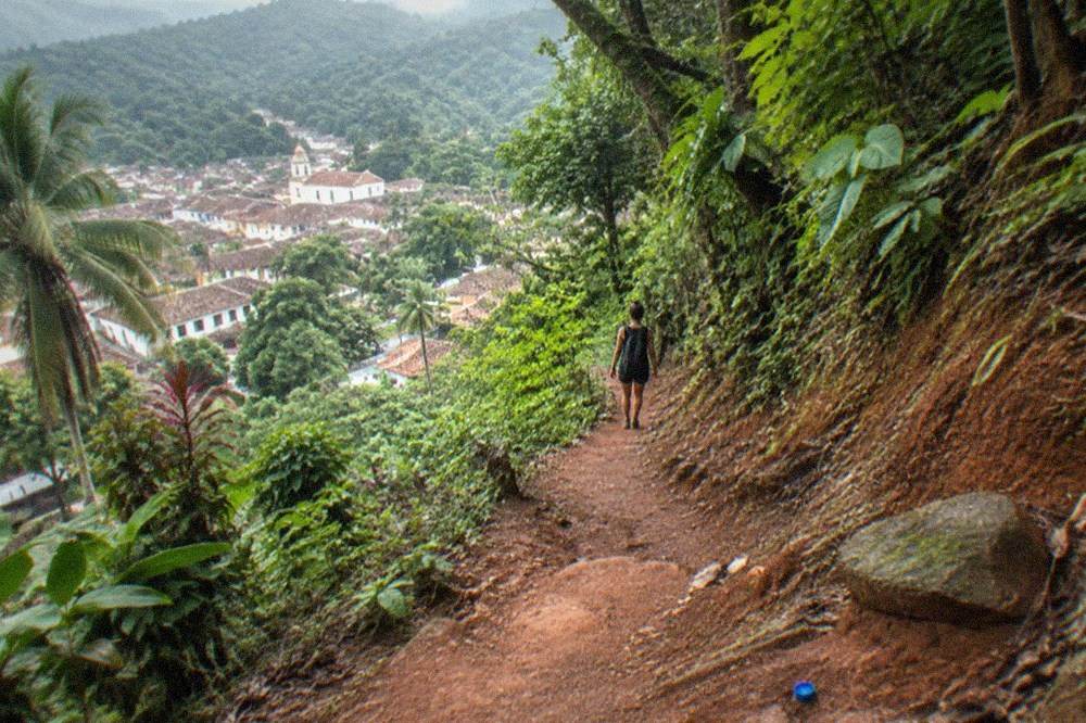 A mountain trail winding through green jungle in the Sierra Madre foothills